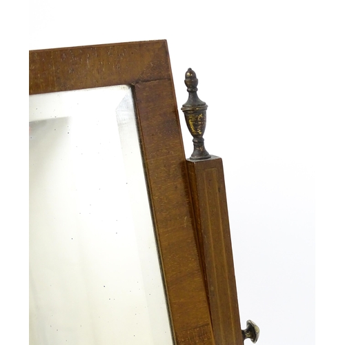 1604 - A late 19thC / early 20thC mahogany and satinwood crossbanded mirror having a square glass flanked b... 