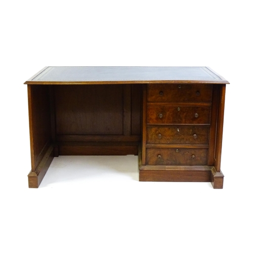 1631 - A mid / late 20thC desk with a gold tooled leather top. 54