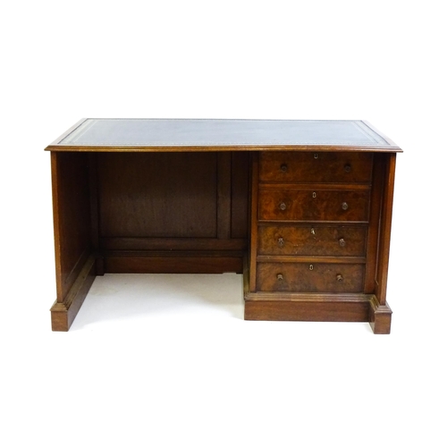 1631 - A mid / late 20thC desk with a gold tooled leather top. 54