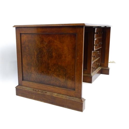 1631 - A mid / late 20thC desk with a gold tooled leather top. 54