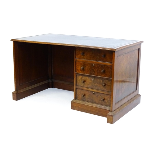 1631 - A mid / late 20thC desk with a gold tooled leather top. 54