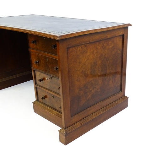 1631 - A mid / late 20thC desk with a gold tooled leather top. 54