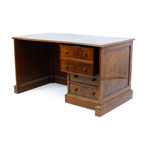 1631 - A mid / late 20thC desk with a gold tooled leather top. 54