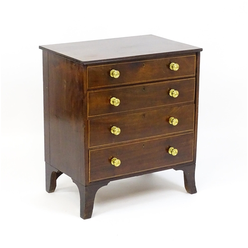 1642 - An early 20thC mahogany chest of drawers with a rectangular top above four long drawers with brass k... 