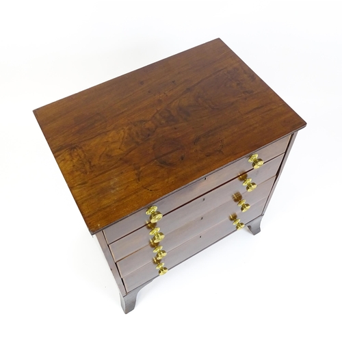 1642 - An early 20thC mahogany chest of drawers with a rectangular top above four long drawers with brass k... 