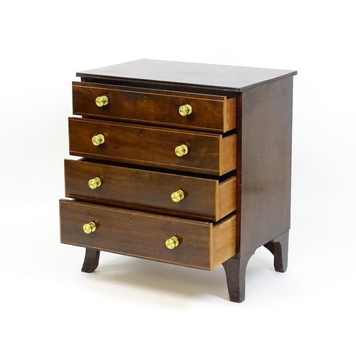 1642 - An early 20thC mahogany chest of drawers with a rectangular top above four long drawers with brass k... 