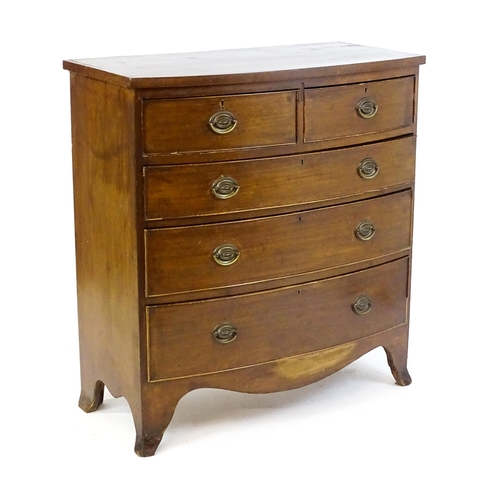 1646 - A late Victorian mahogany bow fronted chest of drawers comprising two short over three long drawers ... 