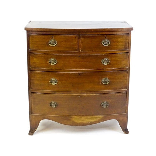 1646 - A late Victorian mahogany bow fronted chest of drawers comprising two short over three long drawers ... 