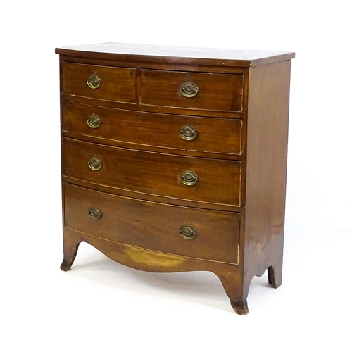 1646 - A late Victorian mahogany bow fronted chest of drawers comprising two short over three long drawers ... 