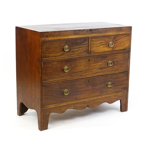 1648 - An early 19thC mahogany chest of drawers with a rectangular top above two short over two long drawer... 