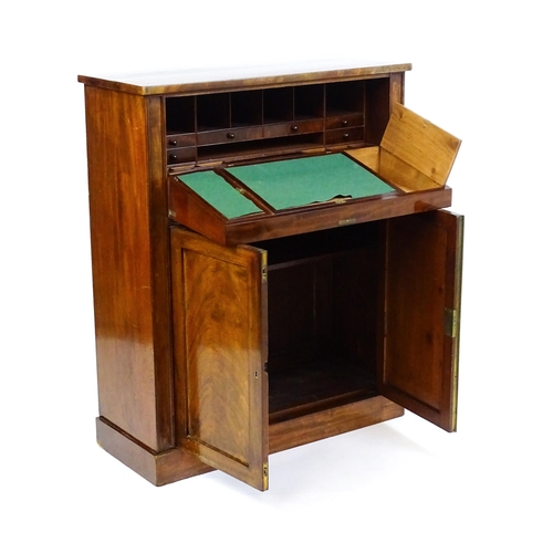 1663 - A 19thC mahogany secretaire with a fall front opening to show a fitted interior with pigeon holes, s... 