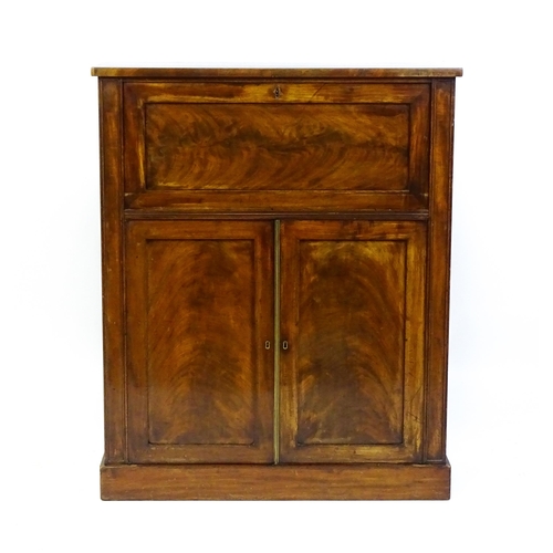 1663 - A 19thC mahogany secretaire with a fall front opening to show a fitted interior with pigeon holes, s... 