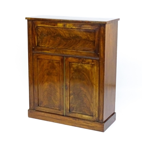 1663 - A 19thC mahogany secretaire with a fall front opening to show a fitted interior with pigeon holes, s... 