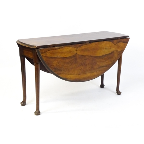 1668 - A 19thC rosewood drop leaf table flanked to each side by a demi lune leaf, the table raised on turne... 