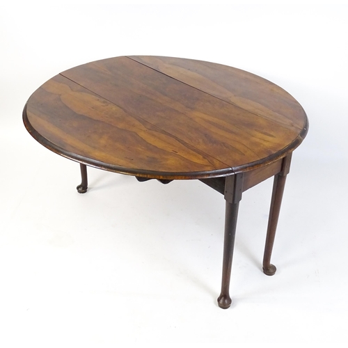 1668 - A 19thC rosewood drop leaf table flanked to each side by a demi lune leaf, the table raised on turne... 