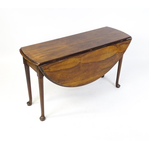 1668 - A 19thC rosewood drop leaf table flanked to each side by a demi lune leaf, the table raised on turne... 