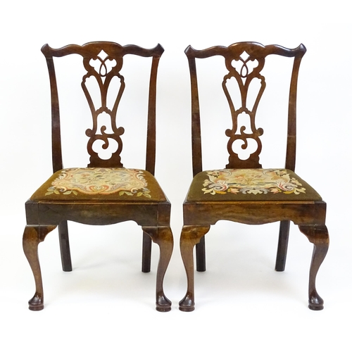 1700 - A pair of early Georgian side chairs with pierced Chippendale back splats above drop in seats and ra... 