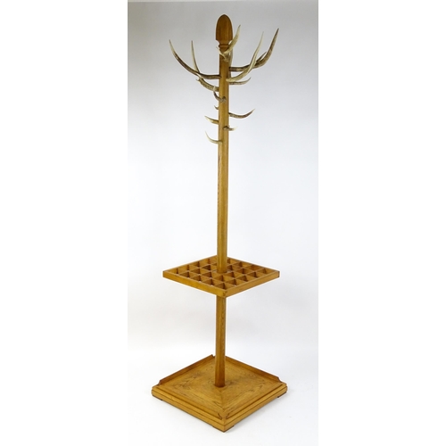 1702 - A late 20thC / early 21stC hall stand with antler coat hooks and a twenty-four section stick stand a... 