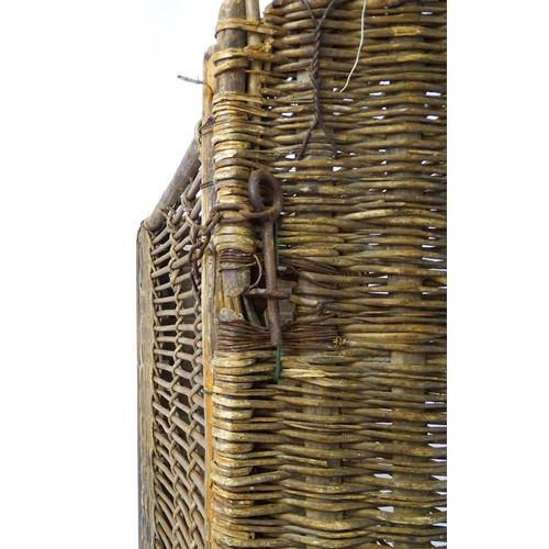 1703 - An early 20thC wicker factory trolley with a hinged lid and raised on six castors. 51