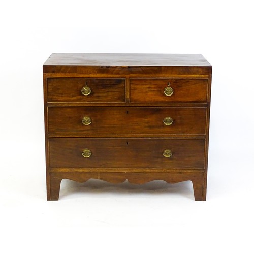 1648 - An early 19thC mahogany chest of drawers with a rectangular top above two short over two long drawer... 