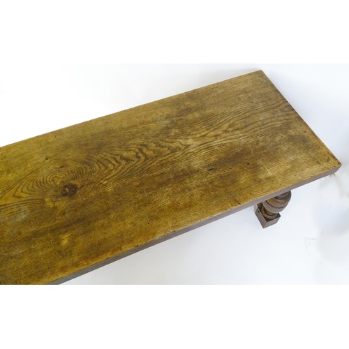 1617 - A late 19thC oak refectory table with a rectangular top above four cup and cover legs united by a H-... 