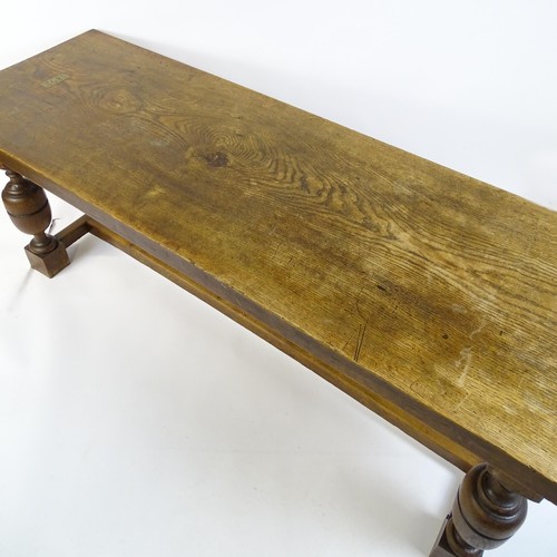 1617 - A late 19thC oak refectory table with a rectangular top above four cup and cover legs united by a H-... 