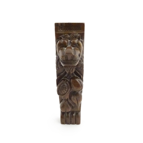 1090 - A 19thC carved mahogany bracket with carved lion mask, fruit and paw decoration. Approx. 12 3/4