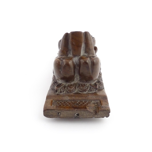 1090 - A 19thC carved mahogany bracket with carved lion mask, fruit and paw decoration. Approx. 12 3/4