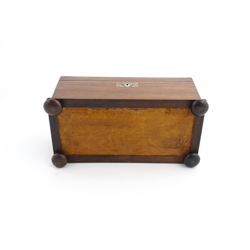 1094 - A 19thC rosewood tea caddy of sarcophagus form with inlaid foliate and foliate mother of pearl detai... 