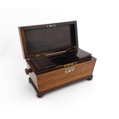 1094 - A 19thC rosewood tea caddy of sarcophagus form with inlaid foliate and foliate mother of pearl detai... 