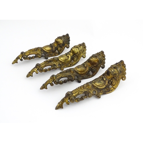 1098 - Four 19thC brass caryatid mounts. Approx. 9