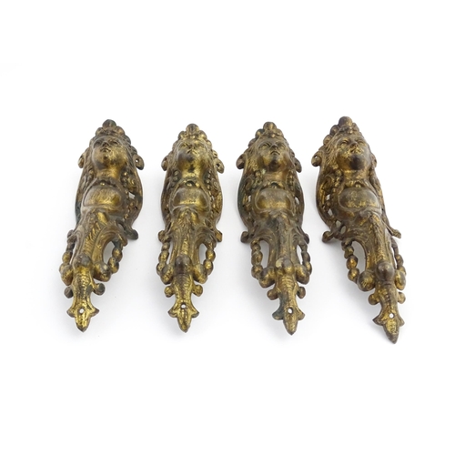 1098 - Four 19thC brass caryatid mounts. Approx. 9