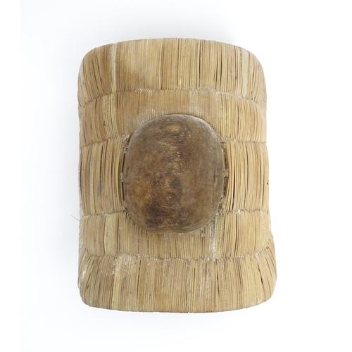 1101 - Ethnographic / Native / Tribal : A small African wicker shield of curved form with central boss. App... 