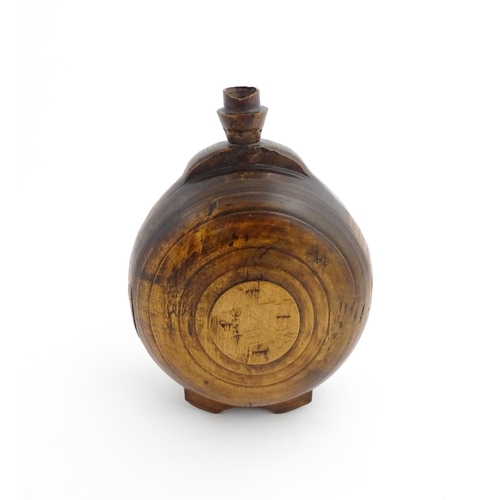 1120 - Treen : A 19thC Scottish turned wooden water flask. Approx. 9 1/2