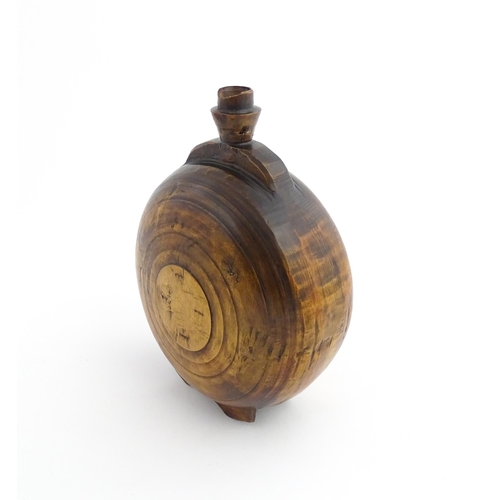 1120 - Treen : A 19thC Scottish turned wooden water flask. Approx. 9 1/2