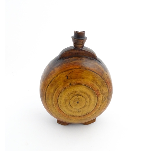 1120 - Treen : A 19thC Scottish turned wooden water flask. Approx. 9 1/2