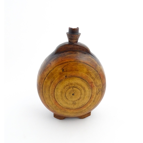 1120 - Treen : A 19thC Scottish turned wooden water flask. Approx. 9 1/2