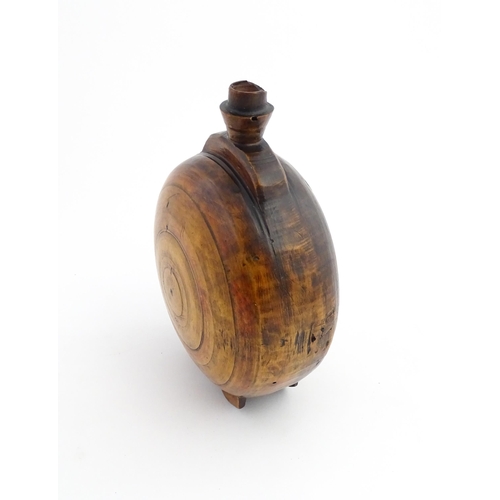 1120 - Treen : A 19thC Scottish turned wooden water flask. Approx. 9 1/2