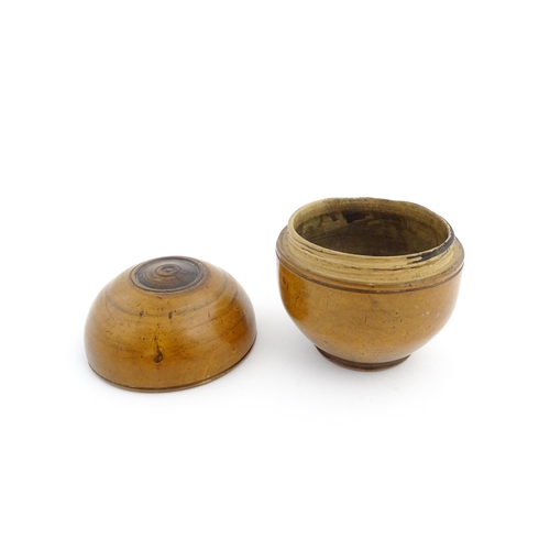 1125 - Treen : A 19thC turned boxwood ointment jar and cover. Approx. 3 1/4