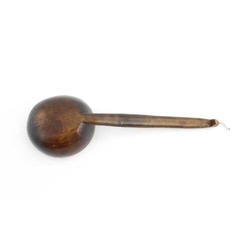 1126 - Treen : A large 19thC Welsh cawl serving ladle. Approx. 15 3/4