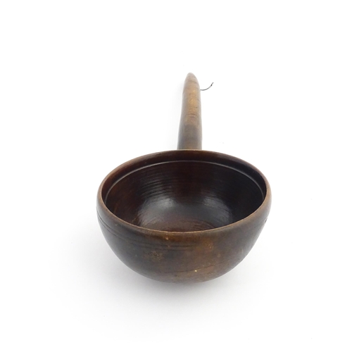 1126 - Treen : A large 19thC Welsh cawl serving ladle. Approx. 15 3/4