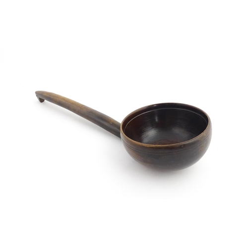 1126 - Treen : A large 19thC Welsh cawl serving ladle. Approx. 15 3/4