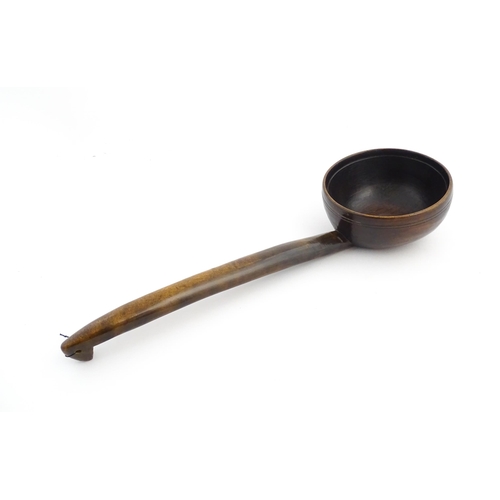 1126 - Treen : A large 19thC Welsh cawl serving ladle. Approx. 15 3/4