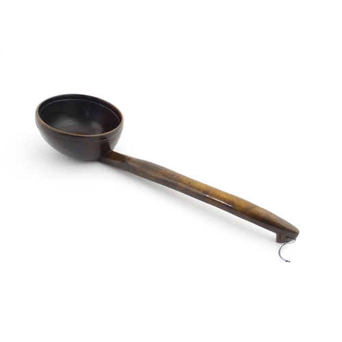 1126 - Treen : A large 19thC Welsh cawl serving ladle. Approx. 15 3/4