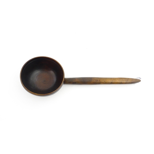 1126 - Treen : A large 19thC Welsh cawl serving ladle. Approx. 15 3/4