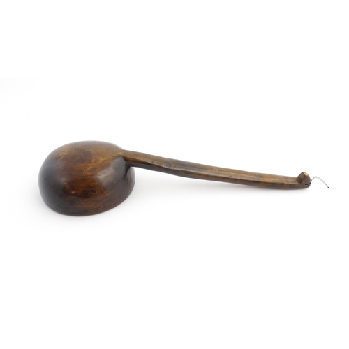 1126 - Treen : A large 19thC Welsh cawl serving ladle. Approx. 15 3/4