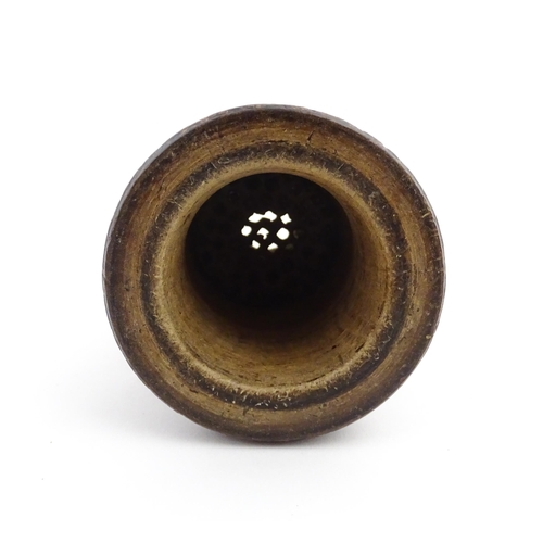 1127 - Treen : An 18thC three sectional turned nutmeg / spice with banded decoration. Approx. 7