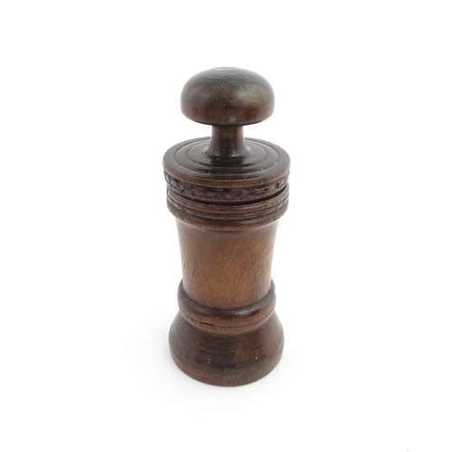 1127 - Treen : An 18thC three sectional turned nutmeg / spice with banded decoration. Approx. 7