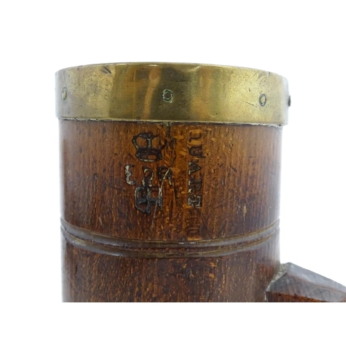 1128 - Treen : Three graduated Victorian and later oak dry measures with brass rims, comprising Quart, Pint... 