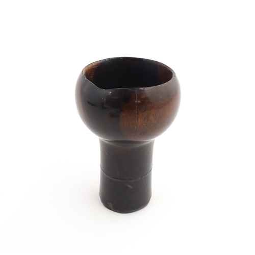 1129 - Treen : A 19thC lignum vitae snuff pestle and mortar of tapering form. Mortar approx. 4 1/4